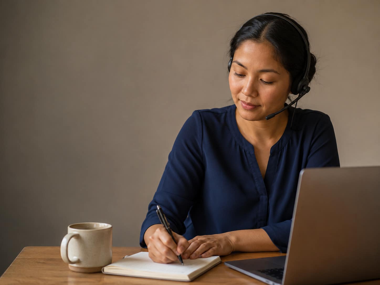 Virtual chiropractic assistant taking notes during a patient call
